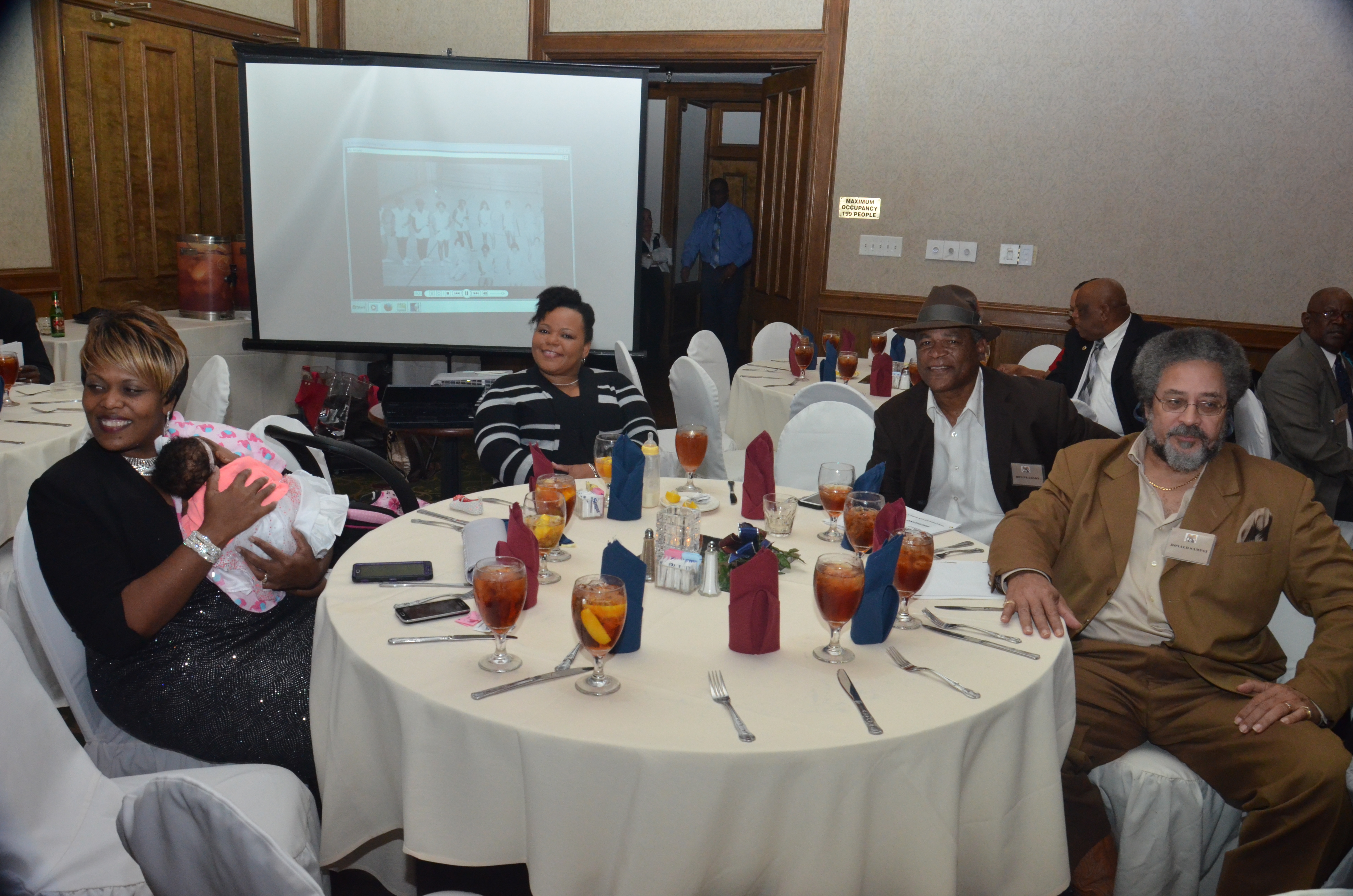A group of people sitting around a table.