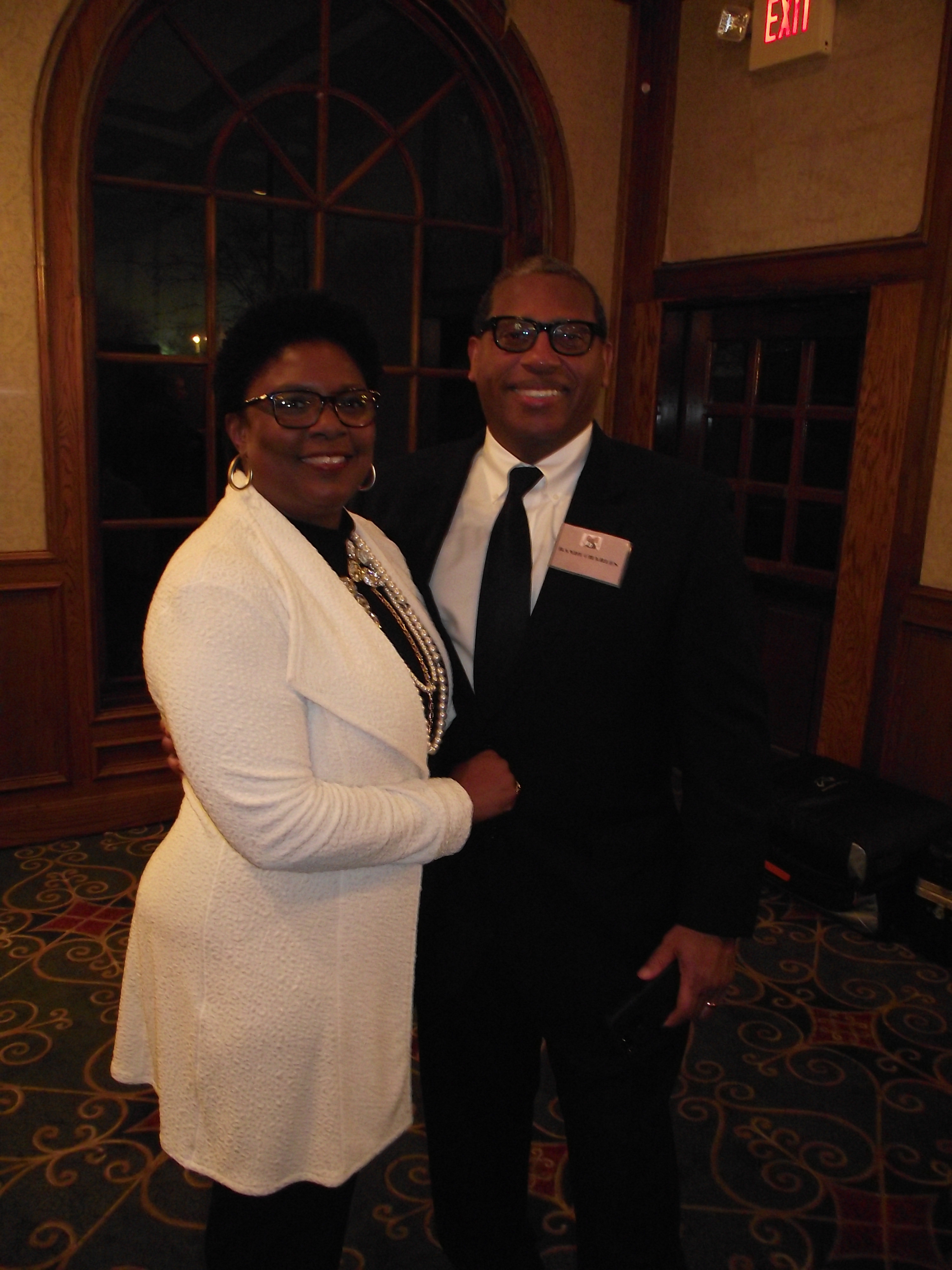 A man and woman are posing for the camera.