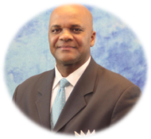 Man in suit with blue tie.