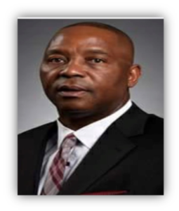 Man in suit with a serious expression.
