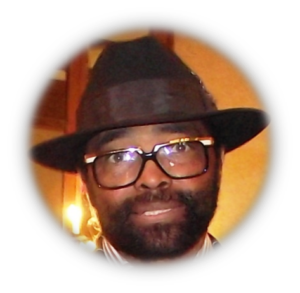 Man wearing glasses and a hat.