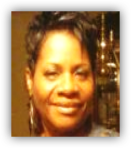 Smiling woman with short dark hair.