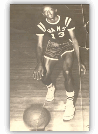 Basketball player dribbling on court.