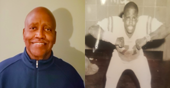 Smiling man beside vintage sports photo.