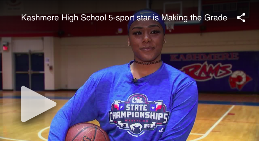 A woman holding onto a basketball on top of the court.