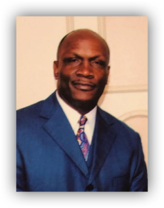 Man in blue suit, formal portrait photo.