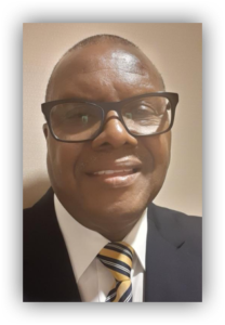 Man wearing glasses and a striped tie.