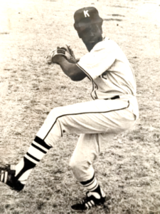 Baseball player pitching on a field.